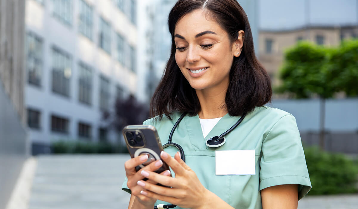 Image of a doctor using shared devices in the workplace.